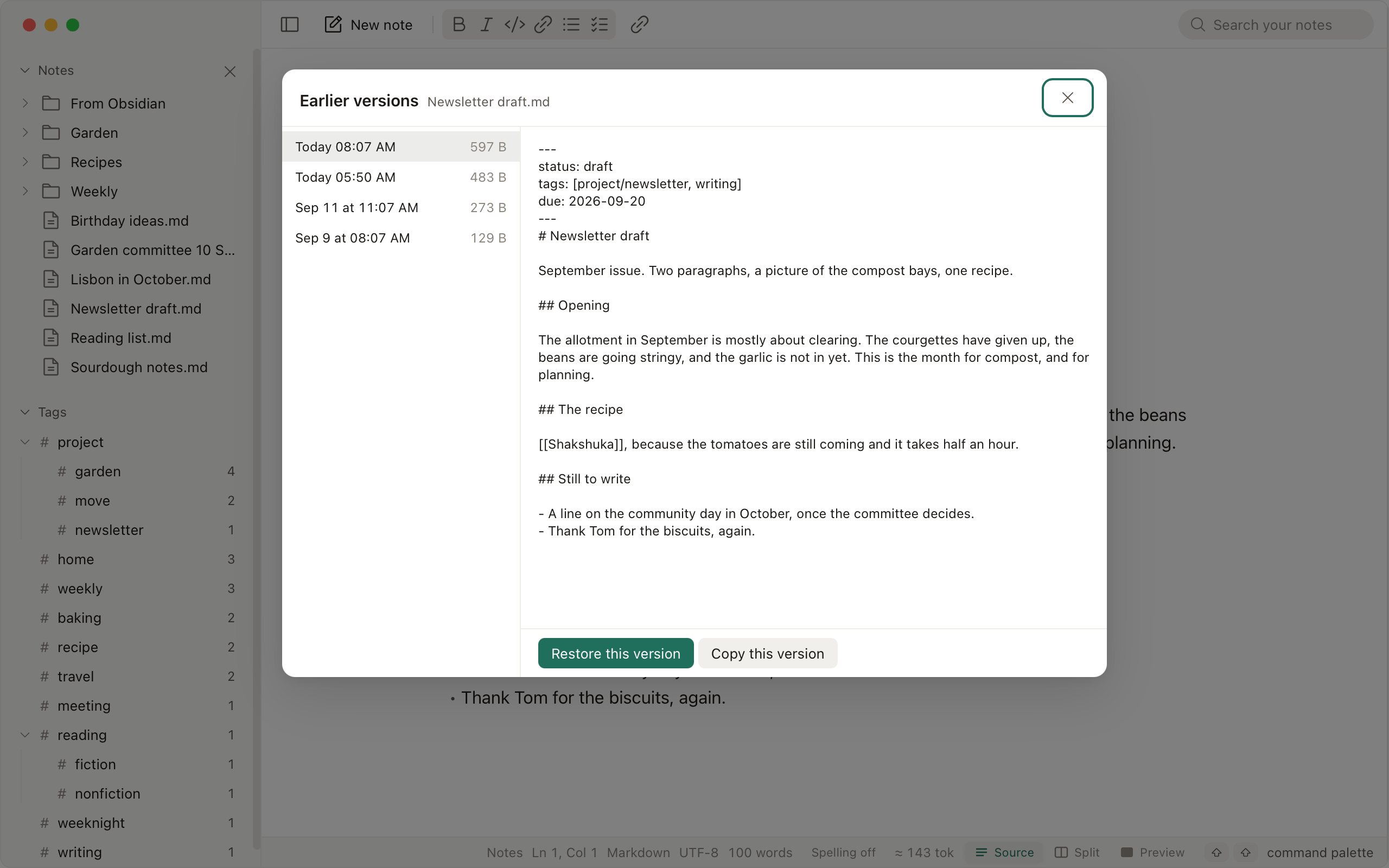 The earlier versions of a note listed beside it, with Revert To on one of them